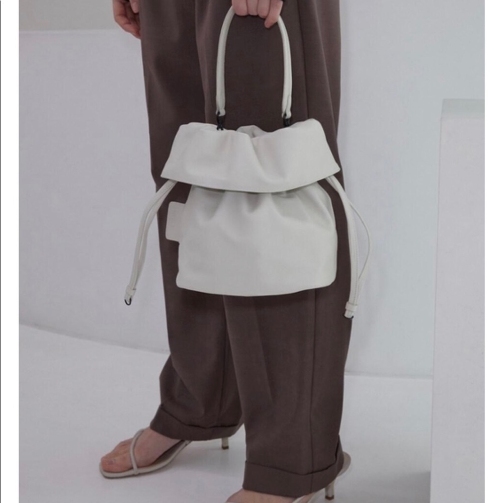 Atclip, contemporary white leather handbag